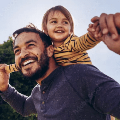 Man with child on shoulders