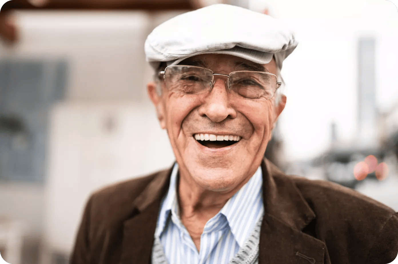 An older man wearing a newsboy cap