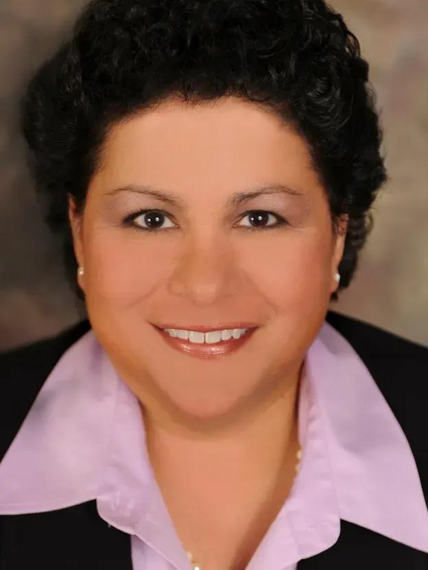 Headshot profile picture of Giovanna E. Olivares, OD, FAAO