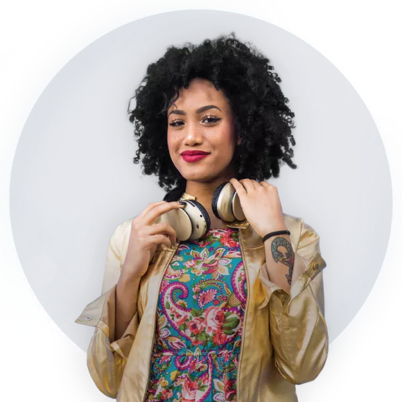 A young woman with curly hair smiling