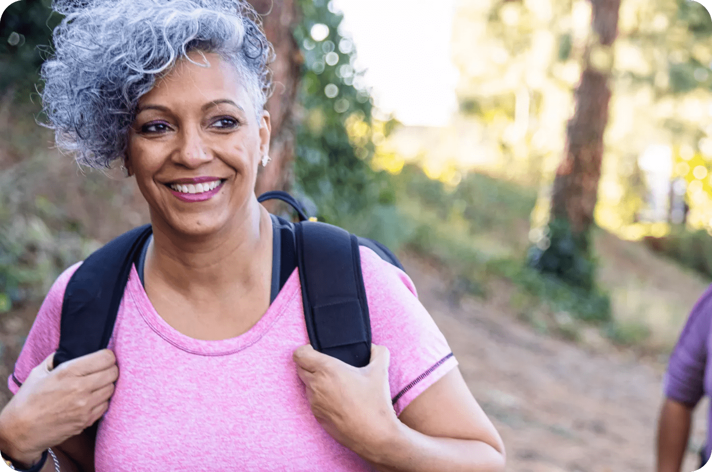 Lady in a pink shirt on a hike