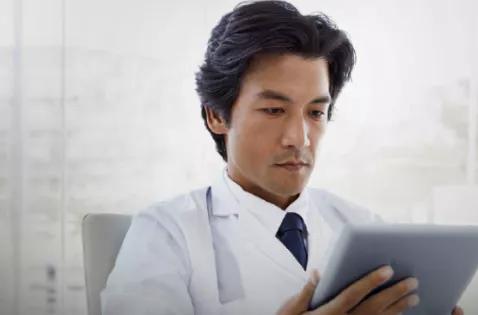 Doctor looking at a tablet